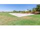 Community basketball court with green grass and trees under a clear blue sky at 20941 E Pecan Ln, Queen Creek, AZ 85142