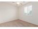 Well-lit bedroom with carpet and a window featuring horizontal blinds at 20941 E Pecan Ln, Queen Creek, AZ 85142