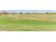 Vast green soccer field with well-manicured grass and surrounding neighborhood views at 20941 E Pecan Ln, Queen Creek, AZ 85142