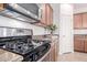 Modern kitchen with stainless steel appliances, granite countertops, and ample cabinet space at 20941 E Pecan Ln, Queen Creek, AZ 85142