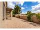 Spacious brick paver patio with a covered area and lush landscaping, great for outdoor gatherings at 20941 E Pecan Ln, Queen Creek, AZ 85142