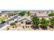 Aerial view of a home featuring an enclosed backyard with patio, desert landscaping, and mature trees at 20941 E Pecan Ln, Queen Creek, AZ 85142