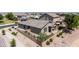 Beautiful rear exterior of the single-story home featuring a fenced yard, desert landscaping and patio area at 20941 E Pecan Ln, Queen Creek, AZ 85142