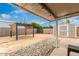 Landscaped backyard featuring a pergola, storage shed, and a mix of brick and rock features at 2131 W Verde Ln, Phoenix, AZ 85015