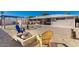 Spacious backyard with a fire pit, covered patio, and outdoor seating area for relaxation at 2131 W Verde Ln, Phoenix, AZ 85015