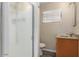Bright bathroom featuring a walk-in shower and vanity with modern fixtures at 2131 W Verde Ln, Phoenix, AZ 85015