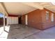 View of the large carport with storage cabinets and access to backyard at 2131 W Verde Ln, Phoenix, AZ 85015