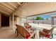 Relaxing covered patio with wicker seating, ideal for outdoor gatherings and leisure at 2131 W Verde Ln, Phoenix, AZ 85015