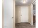 Hallway with wood-look floors and doors to other rooms in the house at 2131 W Verde Ln, Phoenix, AZ 85015