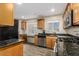 Updated kitchen showcasing stainless steel appliances, granite countertops, and ample cabinetry at 2131 W Verde Ln, Phoenix, AZ 85015