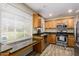 Updated kitchen showcasing stainless steel appliances, granite countertops, and ample cabinetry at 2131 W Verde Ln, Phoenix, AZ 85015