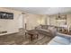Inviting living room with wood-look floors and a dining table set for a cozy meal at 2131 W Verde Ln, Phoenix, AZ 85015