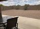 Covered backyard patio with desert landscaping provides outdoor living space with ample space at 2152 S Olivewood --, Mesa, AZ 85209
