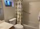 Bathroom featuring shower/bathtub combination, toilet, sink, and light floral print at 2152 S Olivewood --, Mesa, AZ 85209