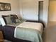 Bedroom featuring neutral walls, carpeted floors, and a closet with sliding doors at 2152 S Olivewood --, Mesa, AZ 85209