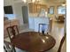 Inviting dining area with a wooden table and chairs, seamlessly connected to the kitchen and living spaces at 2152 S Olivewood --, Mesa, AZ 85209