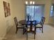 Dining room features a traditional round table with seating for four at 2152 S Olivewood --, Mesa, AZ 85209