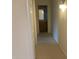 Hallway leading to bathroom with wood cabinets at 2152 S Olivewood --, Mesa, AZ 85209