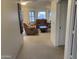 Spacious living room with neutral carpeting, comfortable couches, and bright windows, creating an inviting and relaxing atmosphere at 2152 S Olivewood --, Mesa, AZ 85209