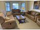 Comfortable living room with multiple seating options and natural light at 2152 S Olivewood --, Mesa, AZ 85209