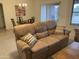Living room and dining area with couch and table at 2152 S Olivewood --, Mesa, AZ 85209