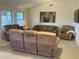 Comfortable living room with multiple seating options and natural light at 2152 S Olivewood --, Mesa, AZ 85209