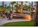 Relaxing backyard patio with comfortable seating around a fire pit feature at 22912 N San Ramon Ct, Sun City West, AZ 85375
