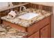 Bathroom featuring granite countertops, white sink, and modern faucet fixtures at 22912 N San Ramon Ct, Sun City West, AZ 85375