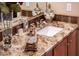 Bathroom with granite countertops, stylish sink, and decorative accents for a luxurious feel at 22912 N San Ramon Ct, Sun City West, AZ 85375
