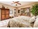Bright bedroom features natural light from shuttered windows, and light carpet at 22912 N San Ramon Ct, Sun City West, AZ 85375