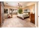 Spacious bedroom featuring a ceiling fan, plantation shutters, and neutral-toned walls and carpet at 22912 N San Ramon Ct, Sun City West, AZ 85375