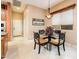 Cozy breakfast nook with stylish lighting and views from the window at 22912 N San Ramon Ct, Sun City West, AZ 85375