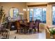 Elegant dining room with a large window and stylish chandelier, perfect for Gathering meals and gatherings at 22912 N San Ramon Ct, Sun City West, AZ 85375