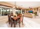 Open dining and living space with tile flooring, large windows, and comfortable seating at 22912 N San Ramon Ct, Sun City West, AZ 85375