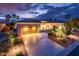 Charming single-story home featuring a tile roof, spacious driveway, and lush desert landscaping at 22912 N San Ramon Ct, Sun City West, AZ 85375