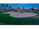 Expansive golf course view highlighting a sand trap with green surroundings and houses beyond at 22912 N San Ramon Ct, Sun City West, AZ 85375
