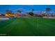 Scenic golf course view, showing the green with flag, sand trap and houses in the background at 22912 N San Ramon Ct, Sun City West, AZ 85375