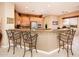 Spacious kitchen featuring granite countertops, breakfast bar, and stainless steel appliances at 22912 N San Ramon Ct, Sun City West, AZ 85375