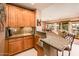 Kitchen bar with granite counters, perfect for entertaining or casual meals, in open floor plan at 22912 N San Ramon Ct, Sun City West, AZ 85375