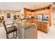 Well-appointed kitchen with granite counters, custom cabinets, and stainless steel appliances at 22912 N San Ramon Ct, Sun City West, AZ 85375