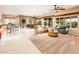 Spacious living room with lots of natural light, a dining area and a breakfast bar at 22912 N San Ramon Ct, Sun City West, AZ 85375