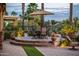 Charming outdoor dining area with a patio umbrella perfect for enjoying the views at 22912 N San Ramon Ct, Sun City West, AZ 85375