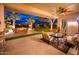 Relaxing outdoor space with comfortable seating around a fire pit, ideal for enjoying evenings outside at 22912 N San Ramon Ct, Sun City West, AZ 85375