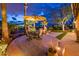 Inviting outdoor patio with dining set and comfortable seating area overlooking the golf course at 22912 N San Ramon Ct, Sun City West, AZ 85375