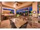 Inviting covered patio featuring a built-in grill and dining area, perfect for entertaining guests outdoors at 22912 N San Ramon Ct, Sun City West, AZ 85375