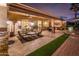 Expansive covered patio with a built-in outdoor kitchen, comfortable seating, and seamless indoor-outdoor living at 22912 N San Ramon Ct, Sun City West, AZ 85375
