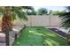 A backyard putting green is surrounded by mature landscaping at 2533 E Flower St, Phoenix, AZ 85016
