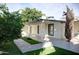 Charming backyard featuring manicured landscaping, a covered patio, and plenty of space for outdoor living at 2533 E Flower St, Phoenix, AZ 85016