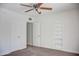 Bedroom featuring a built in book shelf, ceiling fan and plush carpet, creating a comfortable atmosphere at 2533 E Flower St, Phoenix, AZ 85016