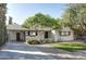 Beautiful single-story house with a long driveway, mature trees, and a well-manicured lawn at 2533 E Flower St, Phoenix, AZ 85016